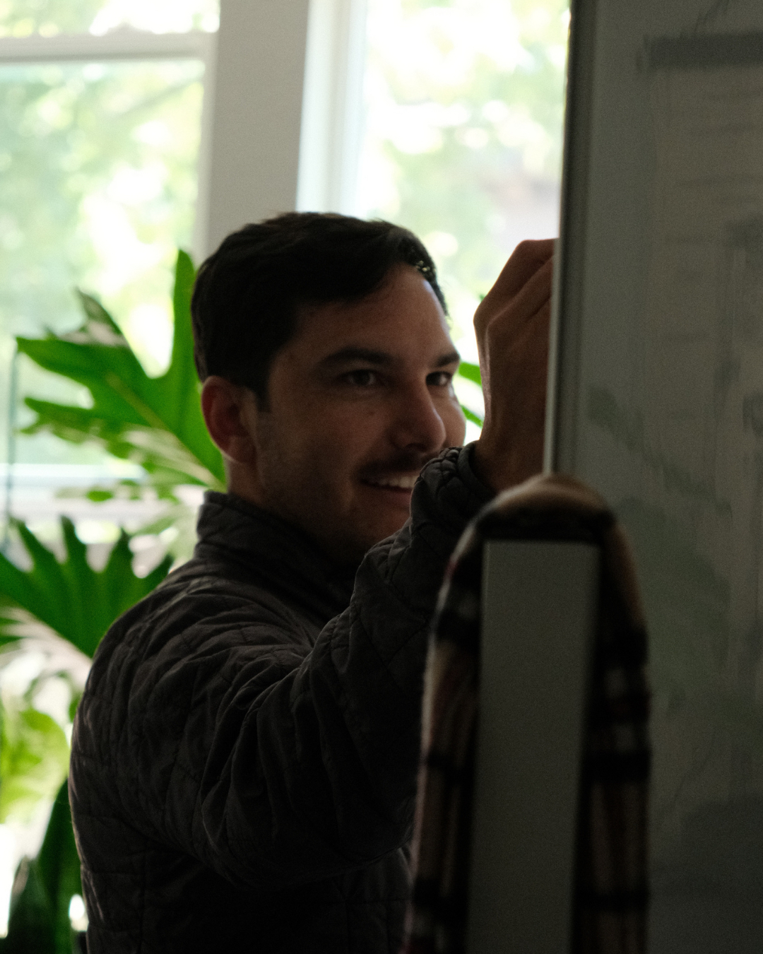 Royce Stanfill working at a whiteboard